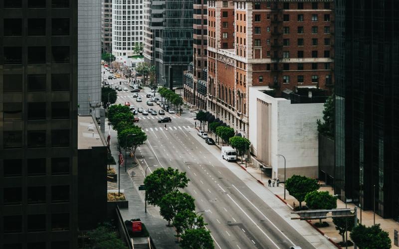 a street between tall buildings